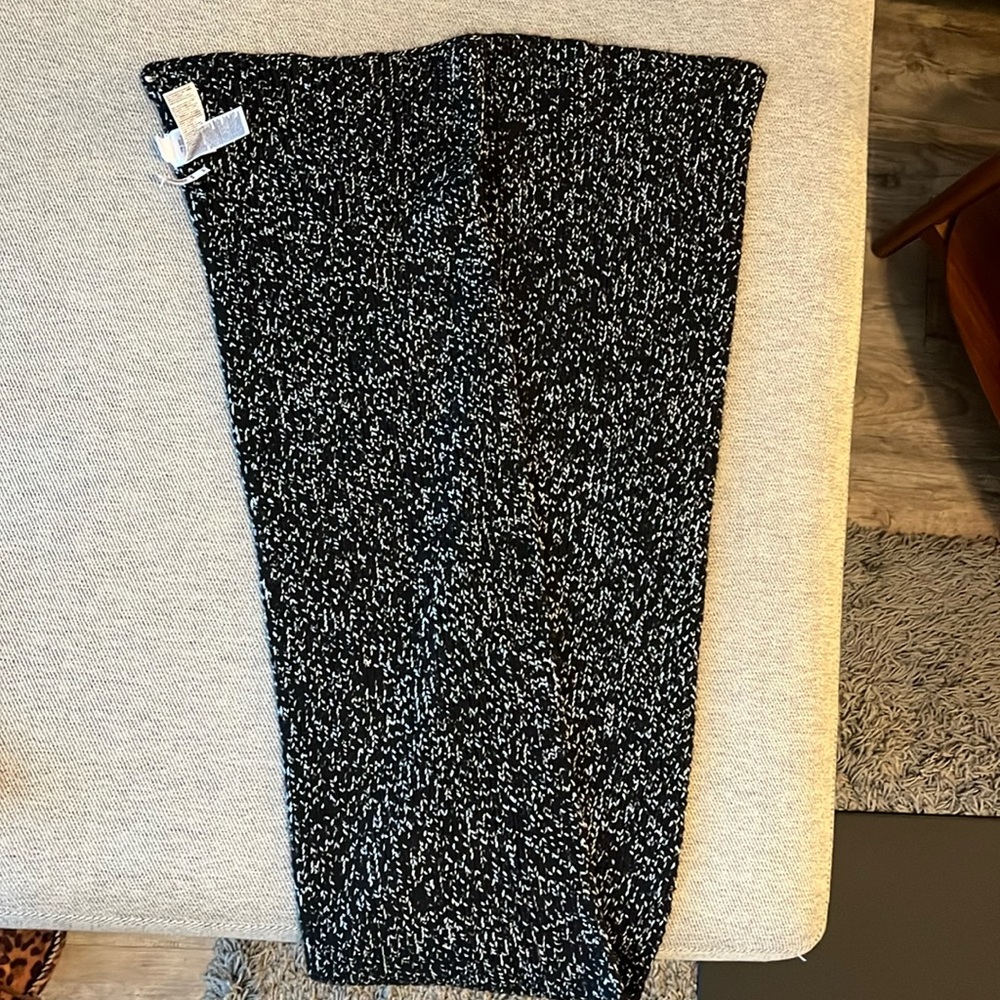 Brand new with tags. Black and silver scarf.